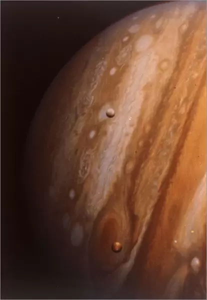 Jupiter, Io and Europa from 20 million kilometres. Creator: NASA