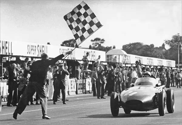 Stirling Moss winning 1957 British Grand Prix at Aintree in the Vanwall. Creator: Unknown