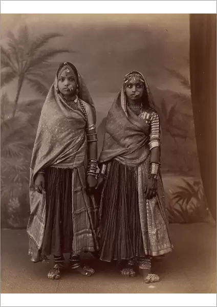Two Hindu Women in Elaborate Jewelry, Before Studio Backdrop with Palm Trees, 1860s-70s