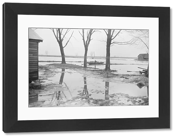 Farmyard covered with flood waters near Ridgeley, Tennessee, 1937. Creator: Walker Evans