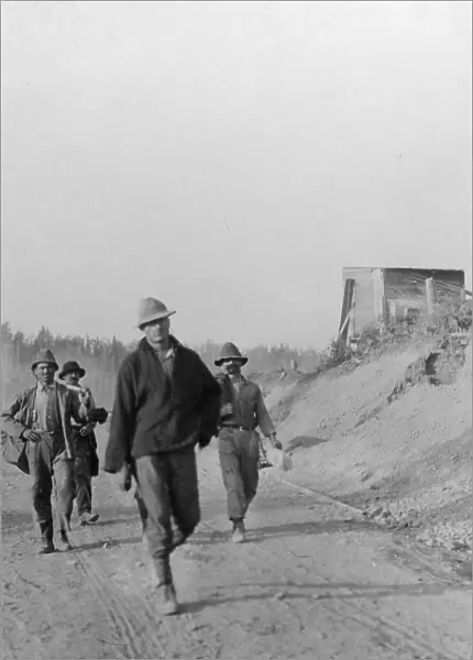 Men walking on dirt road, between c1900 and 1916. Creator: Unknown