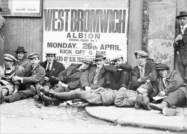 Football fans queue on the morning of a F. A. Cup match outside the Chelsea F. C. ground at Stamford Bridge