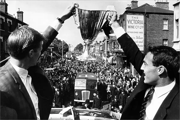 Peter Baker, left, and Jimmy Greaves with the European Cupwinners cup on their victory parade through North London 1963