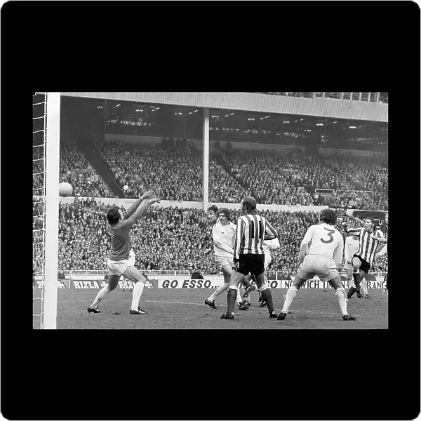 Ian Porterfield's (right) shot flies over Leeds goalkeeper David Harvey to score the goal that gave 2nd division Sunderland a miraculous victory against the favourites