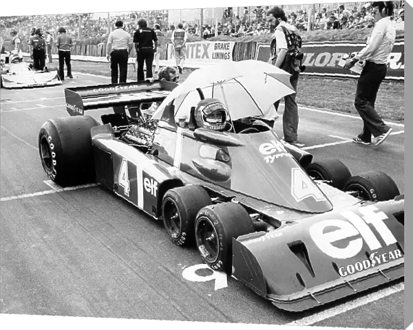 Racing driver Patrick Depailler in his 6 wheel Elf Tyrrell at Brands Hatch for the 1976 Grand Prix