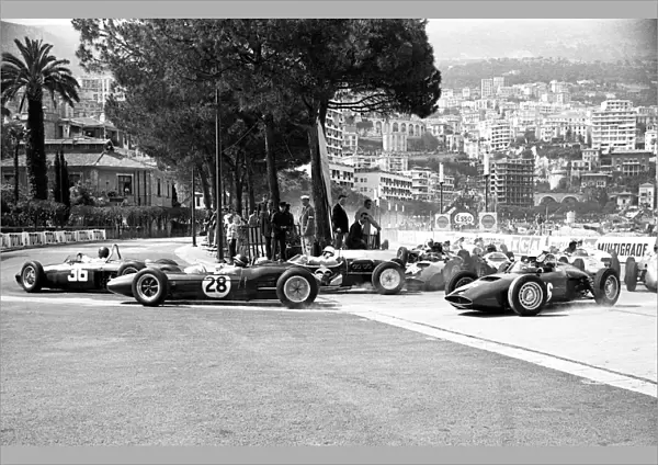 Formula One World Championship: Ritchie Ginther leads from Jim Clark Lotus 21 and winner Stirling Moss, Lotus 18