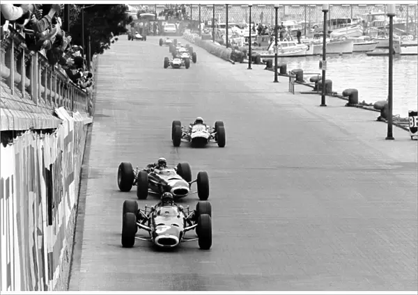 Formula One World Championship: Lap 1: Winner Graham Hill BRM P261 leads a sideways Jackie Stewart BRM P261 and Lorenzo Bandini(2nd Ferrari 1512