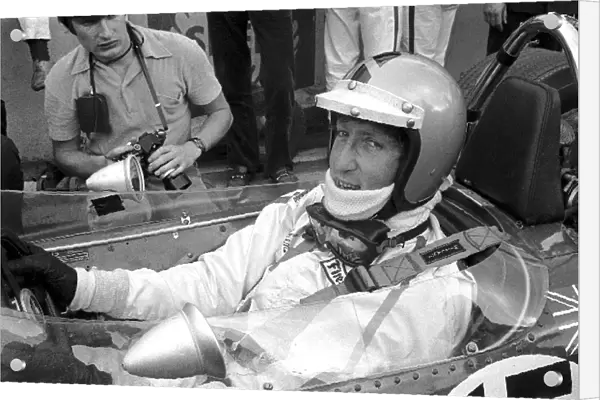 Formula One World Championship: Jochen Rindt wearing Piers Courages helmet, in preference to his own full face variety