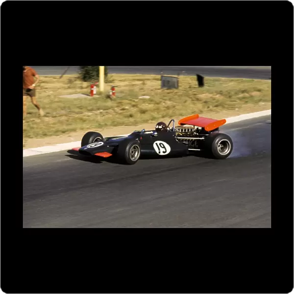 Formula One World Championship: Race retiree Jackie Oliver BRM P153 controls a wild slide