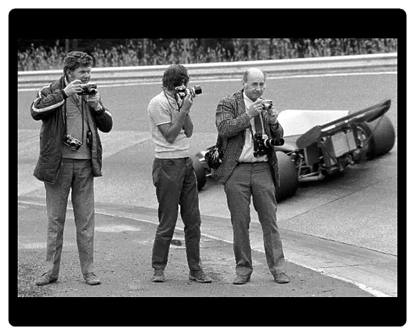 Formula One World Championship: British Photographers, L to R: Maurice Rowe, Laurie Morton, and Geoff Goddard at the famous Karussell corner