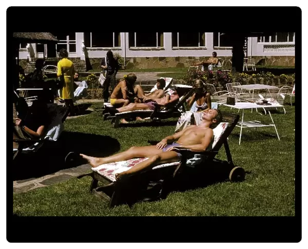 Formula One World Championship: Fifth placed Niki Lauda Ferrari works on his sun tan whilst relaxing at the Kyalami Ranch Hotel