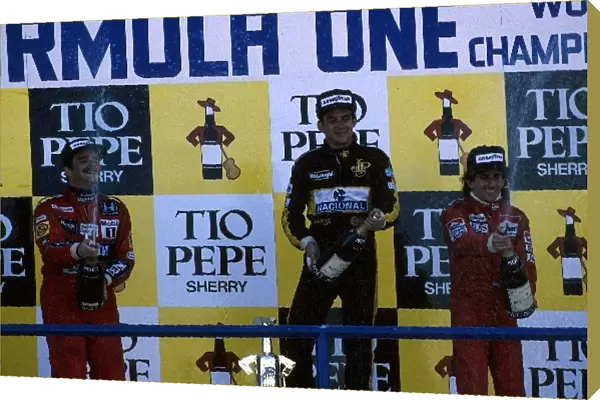 Formula One World Championship: Winner Ayrtin Senna Lotus 98T, Nigel Mansell Williams FW11, 2nd place, and Nelson Piquet Williams FW11, 3rd place