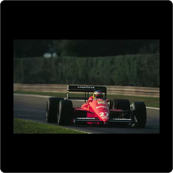 1988 ITALIAN GP. Michele Alboreto, Ferrari, finishes 2nd on the podium behind team