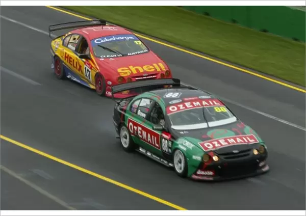 V8 Supercar 2002 AGP : Ford Falcon driver John Bowe leads Paul Radisich during race 3 of