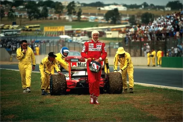 Formula One World Championship: Gerhard Berger pushed the fuel consumption of his McLaren MP4  /  6B to the limit, running out of petrol on the slow-down
