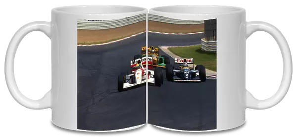 Formula One World Championship: Ayrton Senna McLaren MP4  /  8 leads race winner Alain Prost Williams FW15C and Michael Schumacher Benetton B192B