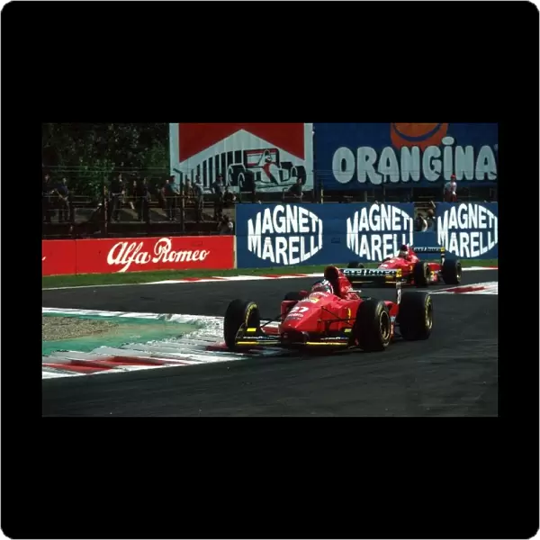 Formula One World Championship: Jean Alesi Ferrari 412T1B who claimed his first pole but retired early in the race leads team mate Gerhard Berger