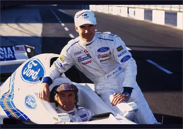 Formula One Testing: L-R: Jackie Stewart and Paul Stewart test their Formula One car, the Stewart Ford SF1