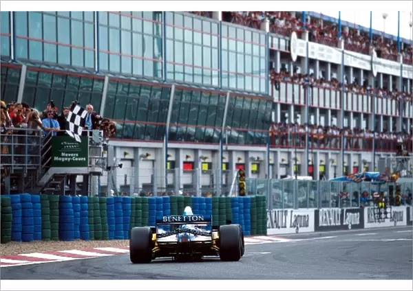 Formula One World Championship: Race winner Michael Schumacher Benetton B195 takes the chequered flag