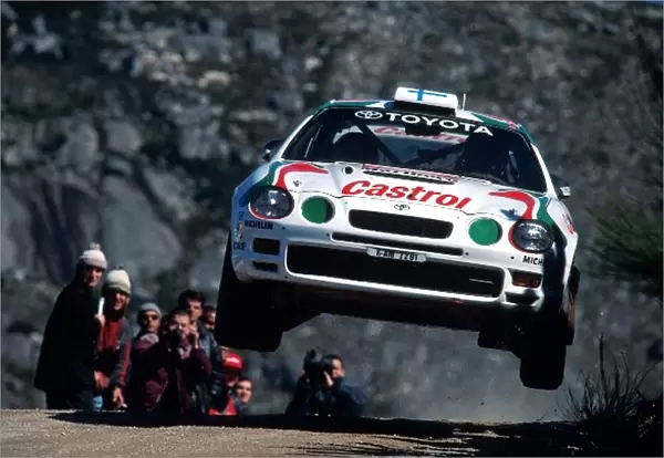 World Rally Championship: Juha Kankkunen Toyota Celica GT-Four with co-driver Nicky Grist flies through the air en route to a 2nd place finish
