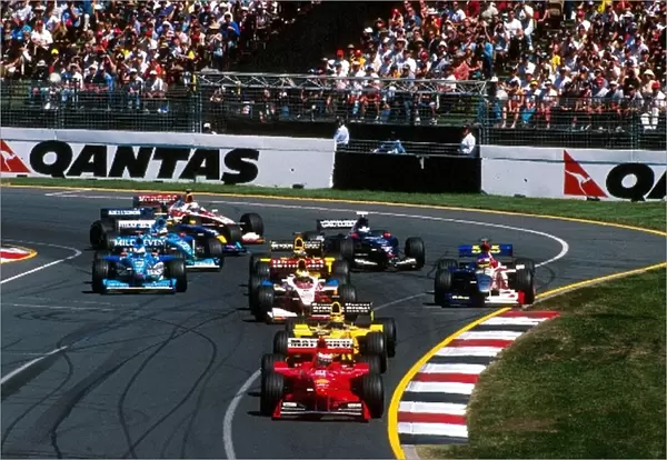Formula One World Championship: WinnerEddie IrvineFerrari F199 leads the midfield at the start