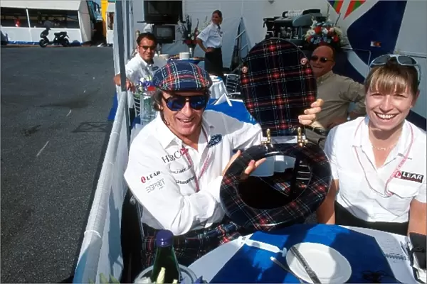 Formula One World Championship: Jackie Stewart recieves a gift from his team