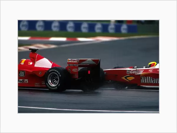Formula One World Championship: Fourth place finisher Ralf Schumacher Williams FW21 makes a move on his brother Michael Schumacher Ferrari F399