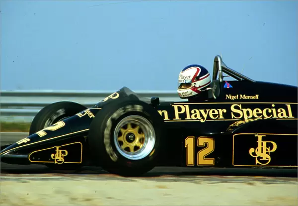 1984 DUTCH GP. Nigel Mansell, Lotus, finishes 3rd on the podium. Photo: LAT