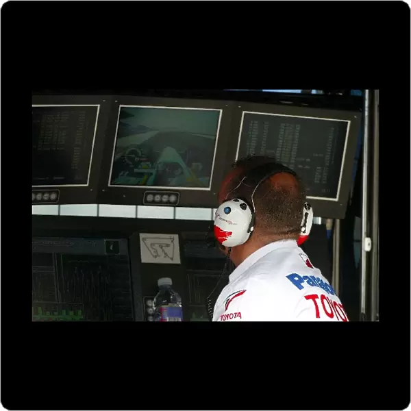 Formula One World Championship: Mike Gascoyne Toyota Technical Director watches the timing screens