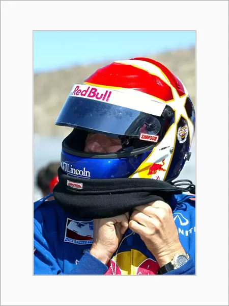 Indy Racing League: Eddie Cheever straps up his helmet for practice at the Copper World 200, Phoenix Intl. Raceway, Phoenix, AZ, 15, March, 2002