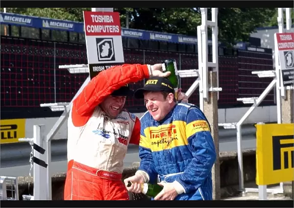 British Rally Championship: Andrew Nesbitt gives Mark Higgins some champagne