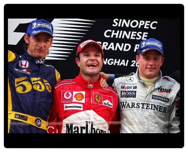 Formula One World Championship: L to R: Second place finisher Jenson Button BAR, race winner Rubens Barrichello Ferrari, and third place finisher