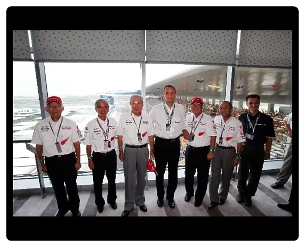 Formula One World Championship: Executives from Matsushita and Michelin with Dr. Akihiko Saito Toyota Executive Vice-President