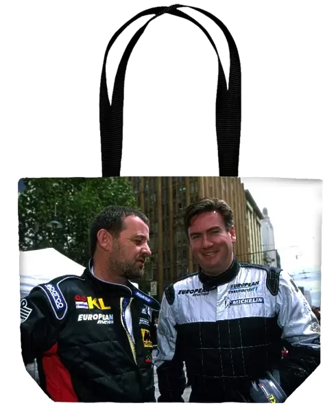Formula One World Championship: Minardi team owner Paul Stoddart, left, chats with TV presenter Eddie McGuire
