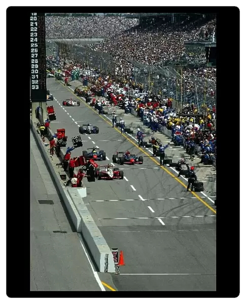 The first round of pit stops at the Indianapolis 500: Indianapolis 500, Indianapolis, USA, 26 May 2002