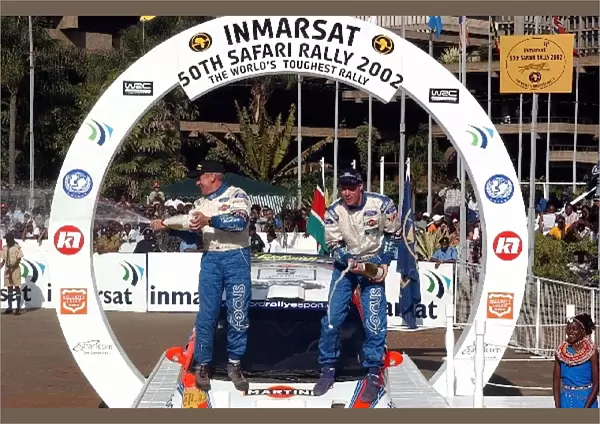 FIA World Rally Championship: Rally winners Colin McRae, right, and co-driver Nicky Grist let the champagne flow