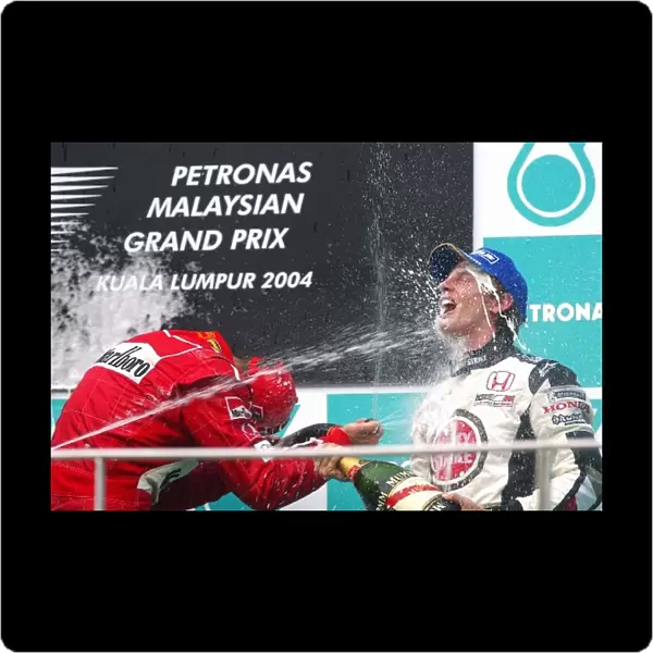Formula One World Championship: third placed Jenson Button BAR with race winner Michael Schumacher Ferrari