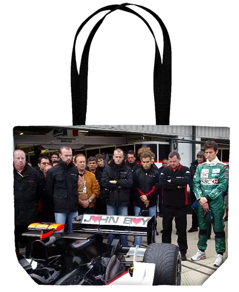 Formula One World Championship: The Minardi team pay their respects to the late John Walton Minardi Sporting Director with a minutes silence