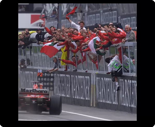 Formula One San Marino Grand Prix - RACE Ferrari team celebrate Michael Schumachers victory Imola, San Marino, 09-04-2000 Pic Steve Etherington  /  LAT email: digital@latphoto. co. uk ref: 18mb digital