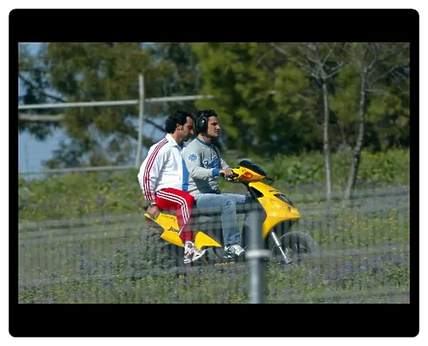 Formula One Testing: Giorgio Pantano, testing for Jordan, takes a trip on a moped