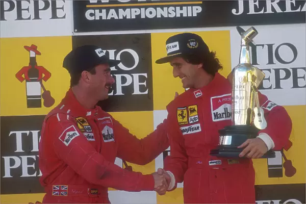 1990 Spanish Grand Prix. Jerez, Spain. 28-30 September 1990. Alain Prost, 1st position celebrates on the podium with teammate Nigel Mansell, 2nd position (both Ferrari). Ref-90 ESP 04. World Copyright - LAT Photographic