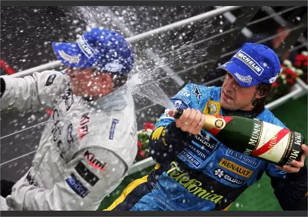 Formula One World Championship: Fernando Alonso Renault sprays race winner Kimi Raikkonen McLaren