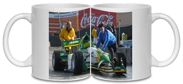 A1 Grand Prix: The car of Christian Fittipaldi A1 Team Brazil is pushed into the pitlane