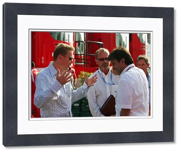 Formula One World Championship: Mika Hakkinen talks with Pasquale Lattuneddu of the FOM