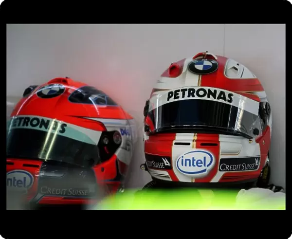 Formula One World Championship: The helmets of Robert Kubica BMW Sauber F1, new design on the right