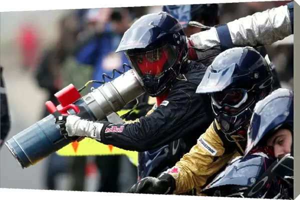 Formula One Testing: Scuderia Toro Rosso mechanics prepare for a pitstop
