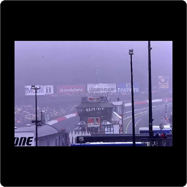 Formula One World Championship: Spa is shrouded in morning mist, causing the first warmup session to be cancelled