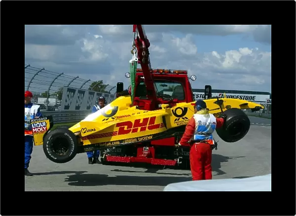 Formula One World Championship: The damaged Jordan EJ12 of Takuma Sato is rescued from the track
