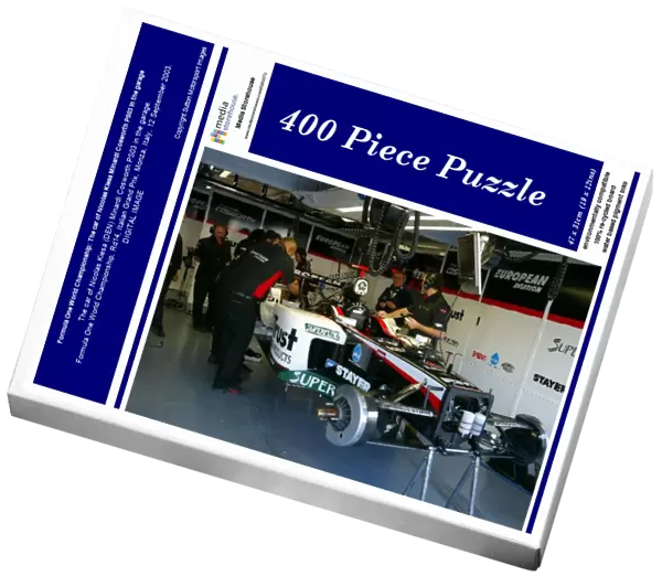 Formula One World Championship: The car of Nicolas Kiesa Minardi Cosworth PS03 in the garage