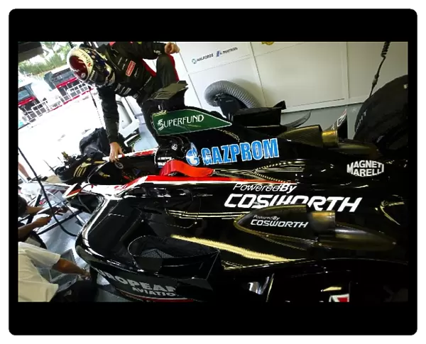 Formula One World Championship: Jos Verstappen gets into a Minardi Cosworth PS03 in the garage